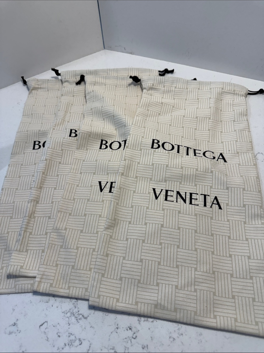 Four Bottega Veneta Cream Woven-Pattern Drawstring Dust Bags